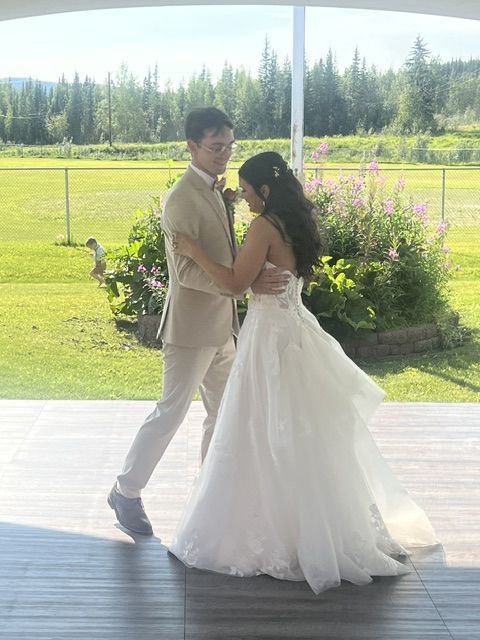 Couple sharing their first dance at an outdoor Maui wedding